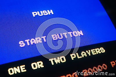 Detail Macro of an old vintage video game with text Push start button Stock Photo