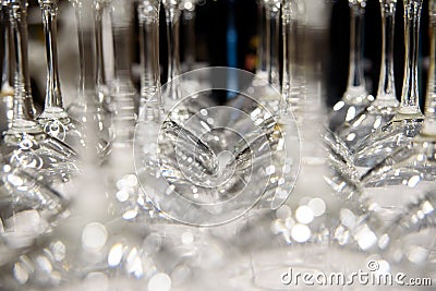 Detail of many clear and clean glass glasses arranged on the table of a bar to serve wine Stock Photo