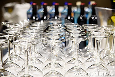 Detail of many clear and clean glass glasses arranged on the table of a bar to serve wine Stock Photo