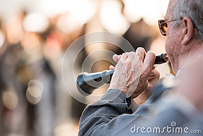 Men playing a typical wind instrument of the celebration of the Fallas of Valencia, called Editorial Stock Photo