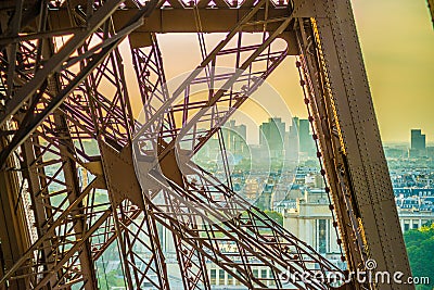 Metal cross on the eiffel tower with Paris on the back. Stock Photo