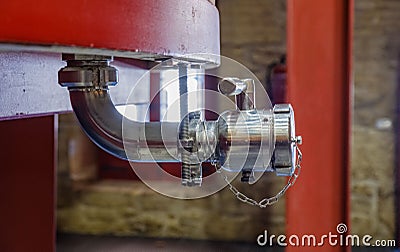 Detail of a metal tap for emptying a large barrel where the grapes begin to ferment to become wi Stock Photo
