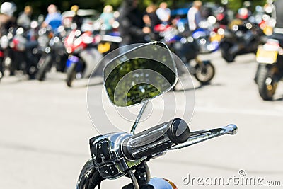 Detail on a motorcycle handlebar with mirror Stock Photo