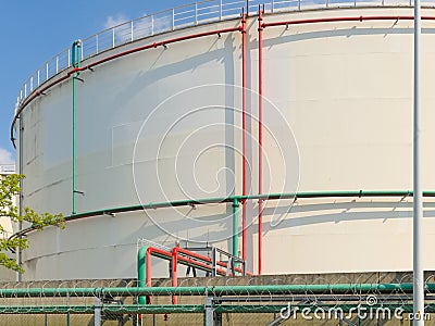Detail of an oil silo with pipes Stock Photo