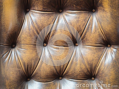 Detail of an old brown couch with buttons Stock Photo