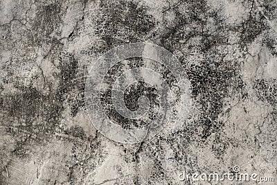 Detail of old cracked wall plaster with damp stains, grunge background Stock Photo