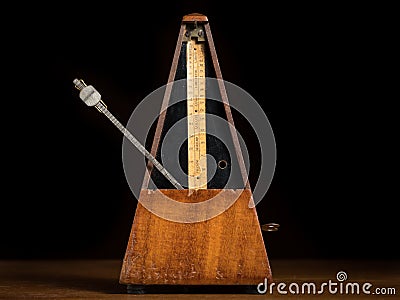 Detail of an old mechanic musical metronome Stock Photo