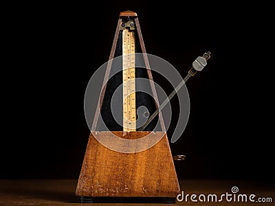 Detail of an old mechanic musical metronome Stock Photo