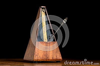 Detail of an old mechanic musical metronome Stock Photo