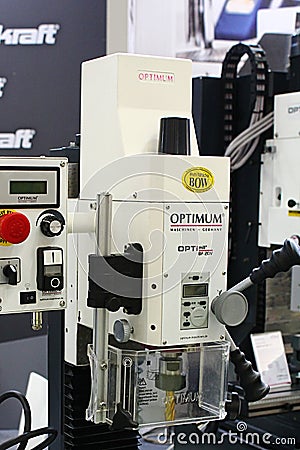 Detail of Optimum OptiMill precision industrial milling machine with protective polycarbonate cover of gold coloured tool attached Editorial Stock Photo