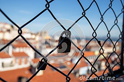 Detail of padlocks placed on the security fence of the Santa Just lift in Lisbon Stock Photo