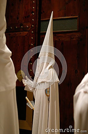 Detail on a hooded penitent waiting for the start of an easter holy week procession in mallorca detail on hoods vertical Editorial Stock Photo