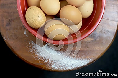 Detail of pile of eggs in red basin Stock Photo