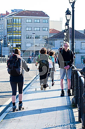 Detail of pilgrims across the Burgo Bridge in Pontevedra Spain Editorial Stock Photo