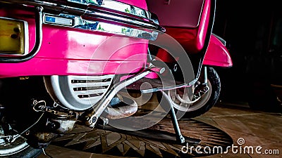 Detail of pink scooter with chromed metallic fender Editorial Stock Photo