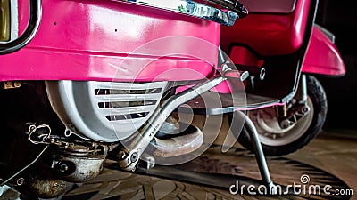 Detail of pink scooter with chromed metallic fender Editorial Stock Photo