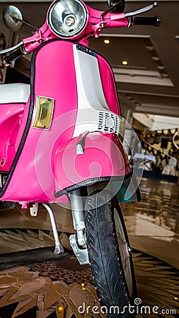 Detail of pink scooter with chromed metallic fender Editorial Stock Photo