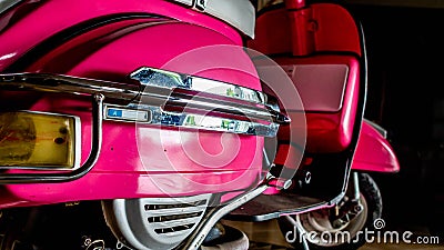 Detail of pink scooter with chromed metallic fender Editorial Stock Photo