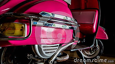 Detail of pink scooter with chromed metallic fender Editorial Stock Photo