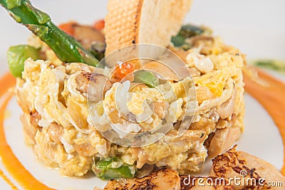 Detail of a plate of scrambled eggs with truffles Stock Photo