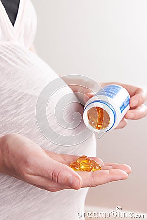 Detail Of Pregnant Woman Taking Vitamins Stock Photo