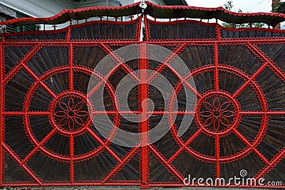 Detail of a red forged metallic gate Stock Photo