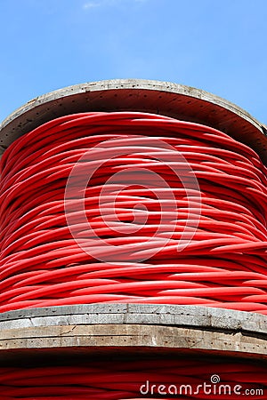 detail of red high-voltage electrical power cable spool Stock Photo