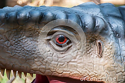 Detail replica of a dinosaur`s head at Dino Park, in Portugal, in real size Editorial Stock Photo