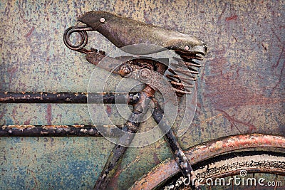 Detail of a rusted ancient bicycle with leather seat Stock Photo