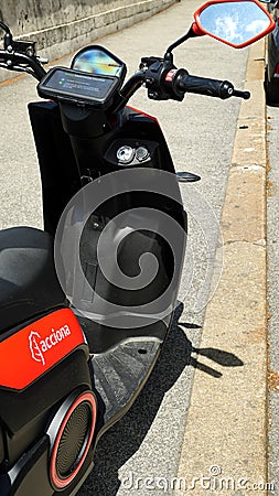 Detail of scooter sharing by ACCIONA, a Spanish company founded in 1997, a group consisting of over 100 companies active in vario Editorial Stock Photo