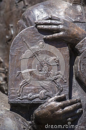 Detail of sculpture Saint George and the Dragon in Ivano-Frankivsk, Ukraine. Saint George the Victorious is regarded as one of the Stock Photo