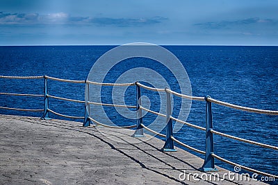 Detail of Sea Wall Roped Barrier Stock Photo