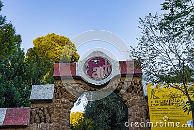 Detail of the secondary entrance to Parc Guell with typical colourful mosaic decorations. Barcelona Editorial Stock Photo