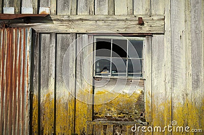 Closeup of an Old Weathered Cannery Building With Rusted Metal Parts. Stock Photo