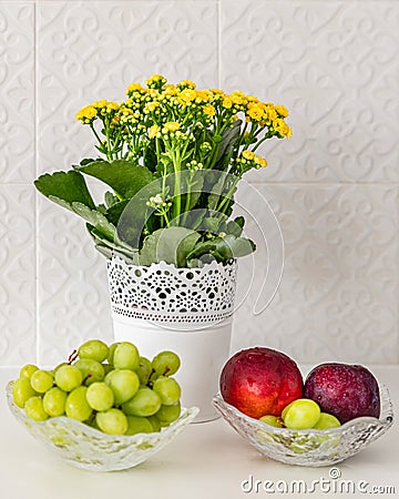 Detail shot of fruit bowls and a flower pot Stock Photo