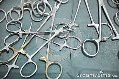 Detail shot of steralized surgery instruments with a hand grabbing a tool Stock Photo