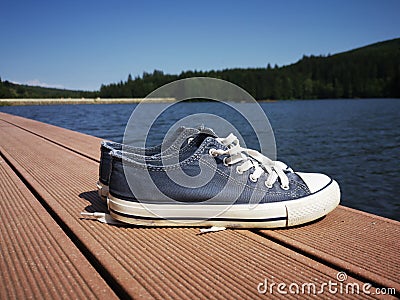 Sneakers near a lake Stock Photo