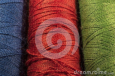 Detail of spools of threads, blue, red, green Stock Photo