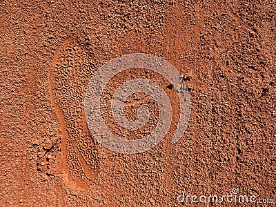 Detail with a sport shoe footprint on a tennis clay court Stock Photo