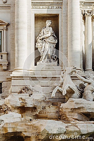 Detail statue of Abundance, Trevi Fountain Fontana di Trevi in Rome, Italy. Stock Photo