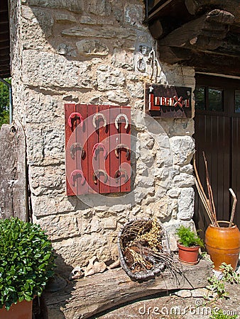 Detail of stone facade with horseshoes. Editorial Stock Photo