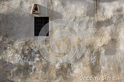 Window in an old medieval wall Stock Photo