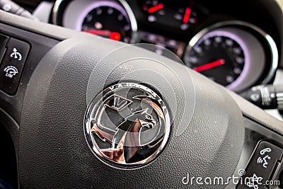 The detail of a streering wheel in Vauxhall Opel Astra with speedometer and odometer turned slightly to the right prepared for Editorial Stock Photo