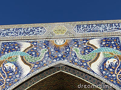 Mythicals birds of the Nadir-Divanbegi madrasha to Bukhara in Uzbekistan. Editorial Stock Photo