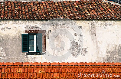 Detail from traditional old Portuguese facade with green and white wooden window Stock Photo