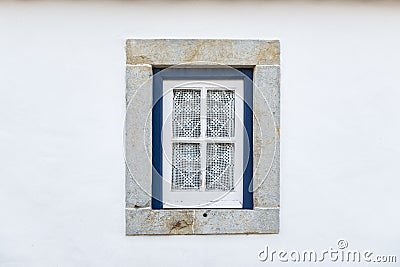 Detail of a traditional window on a white facade of a house Stock Photo