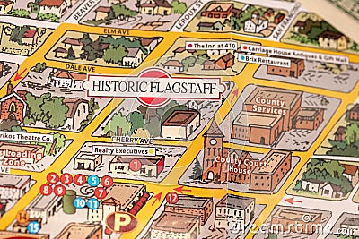 Detail of travel map Flagstaff, Arizona, USA with one Dollar bill just below the couthouse, justice and travel concept Editorial Stock Photo