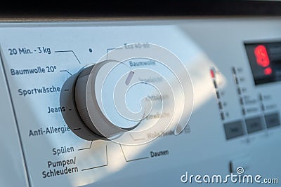 Detail view of washing machine control panel with contemporary thermostat and program selection to switch between different progra Stock Photo