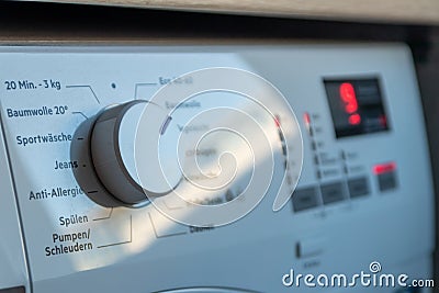 Detail view of washing machine control panel with contemporary thermostat and program selection to switch between different progra Stock Photo