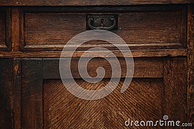 Detail of a vintage cupboard sideboard - drawers with metal handle. vintage retro furniture closeup Stock Photo